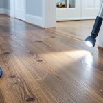 Post-holiday hardwood floor checkup (spot grit scratches, heel dents, and finish wear)