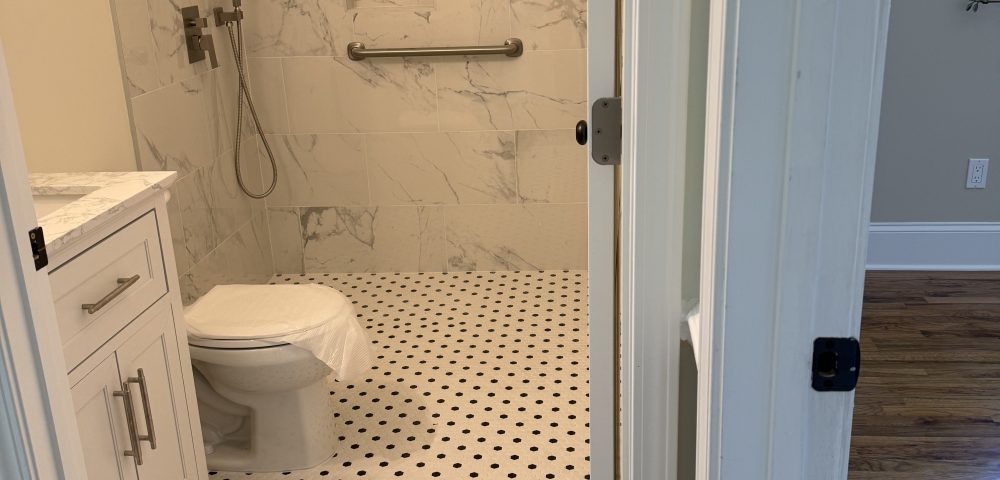 Curbless shower conversions in older homes, floor framing checks, slope math, and where leaks start