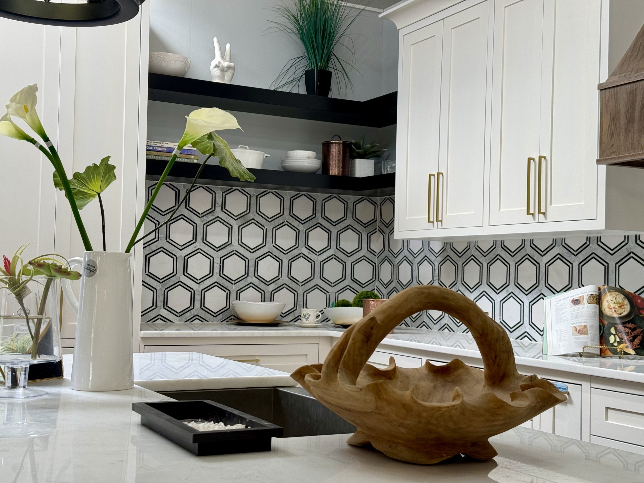 Kitchen remodel with a hexagon tile backsplash, floating shelves and brass hardware